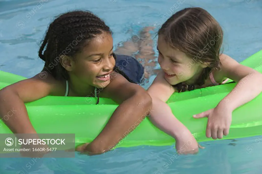 Close-up of two girls on a float