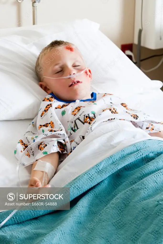 Boy sleeping in hospital bed