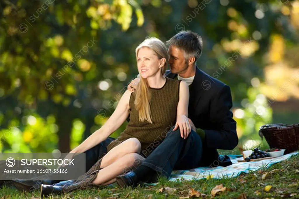 Couple having picnic outdoors