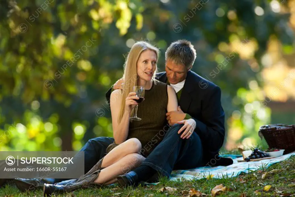 Couple drinking wine outdoors