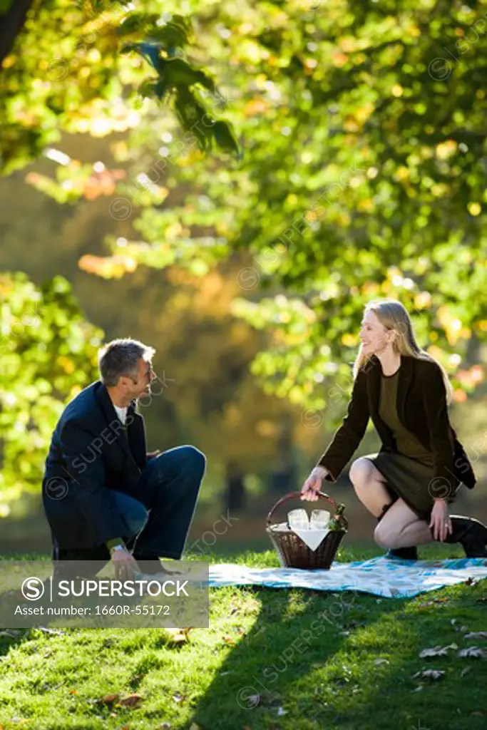 Couple with picnic outdoors