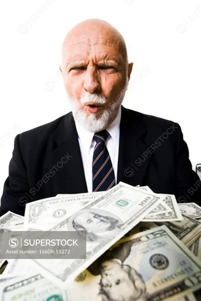 Excited mature man with large sum of money