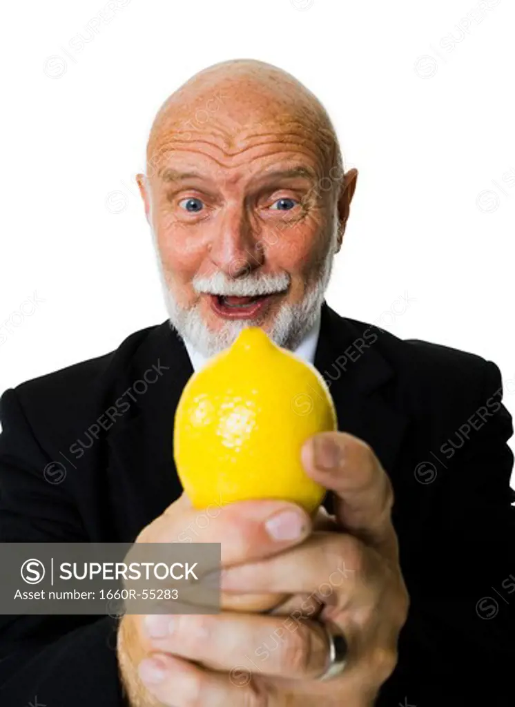 Mature businessman with lemon