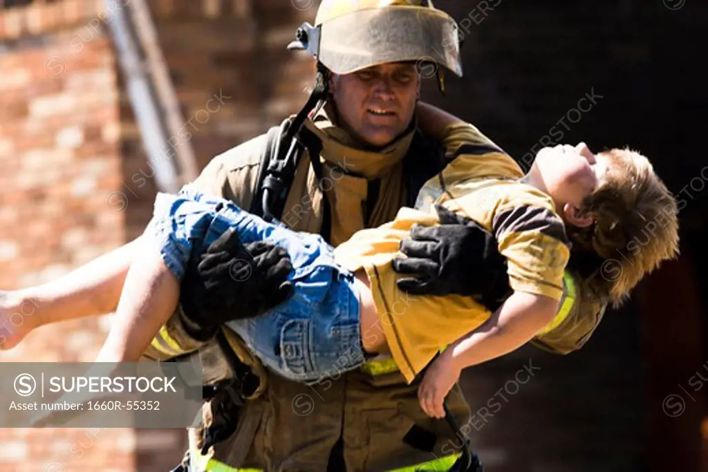 Fire fighter rescuing child