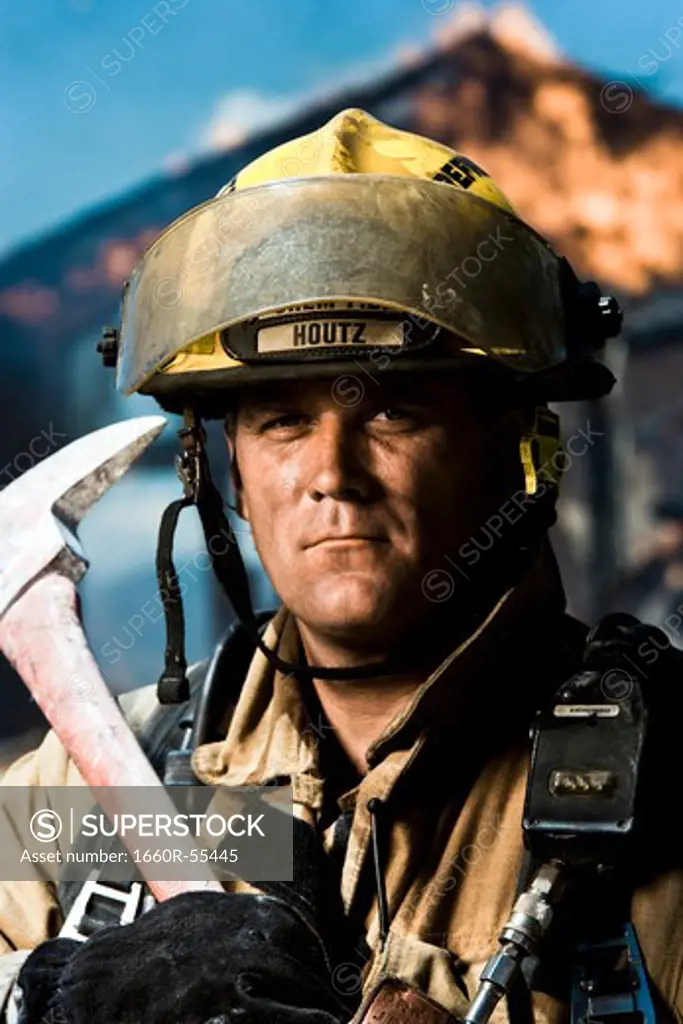 Portrait of a firefighter with axe