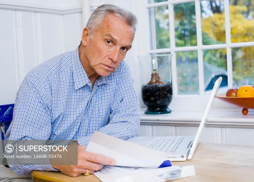 Mature man with laptop