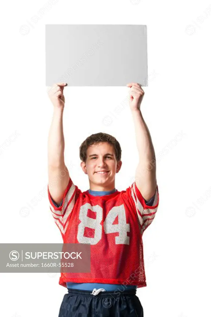 Man in football jersey holding blank sign