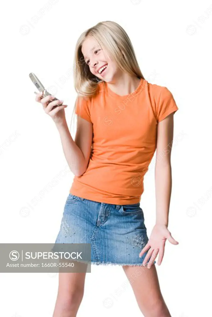 Girl holding cell phone smiling
