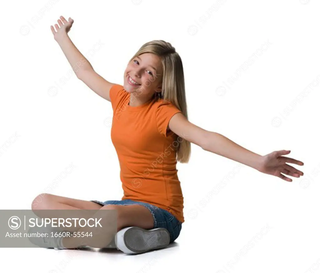 Girl sitting with arms and legs crossed