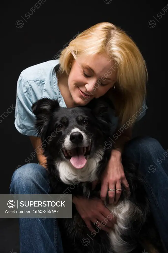 Portrait of a woman with black dog