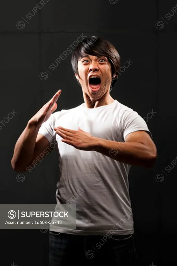 Muscular man with clenched fist shouting