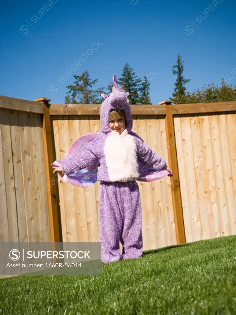 Girl in yard in halloween costume