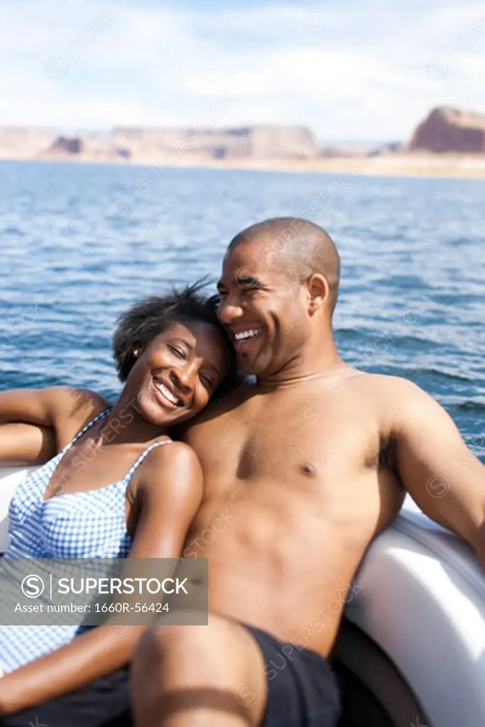 Couple on boat snuggling