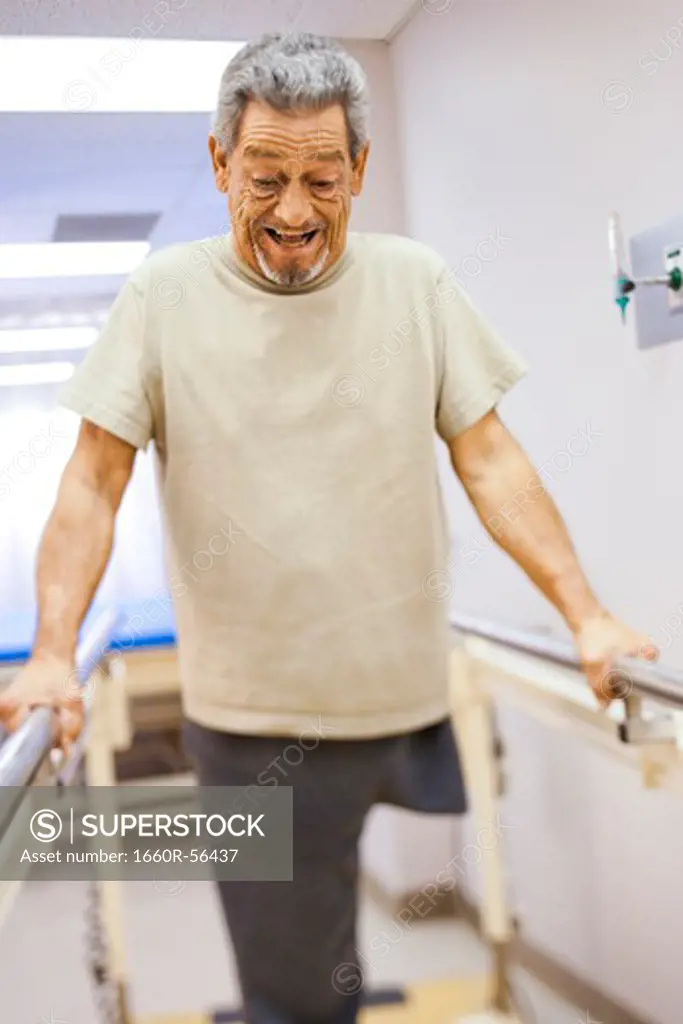 Older man with one leg exercising and smiling