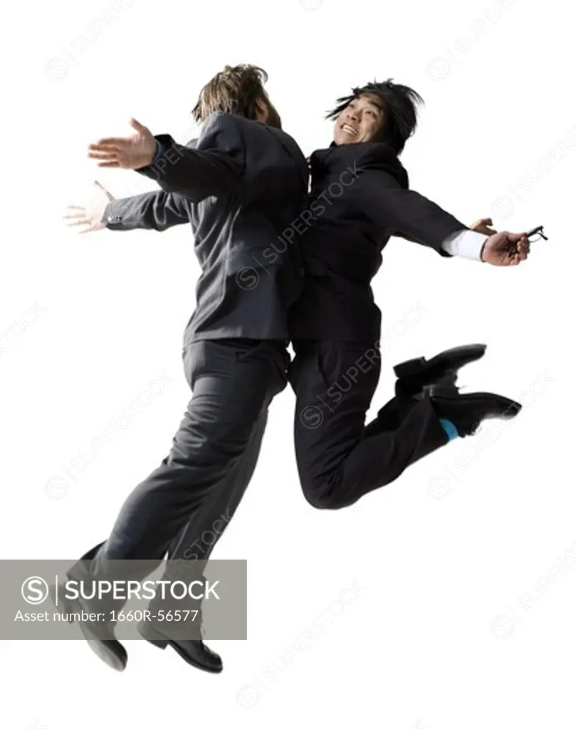 Businessmen jumping