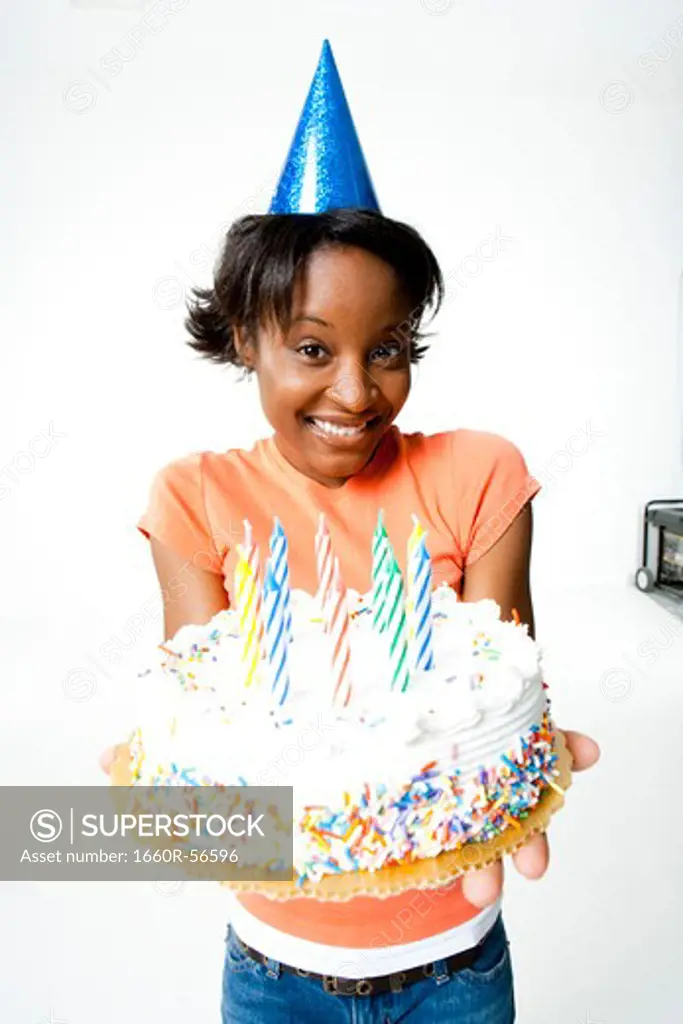 Woman holding a birthday cake