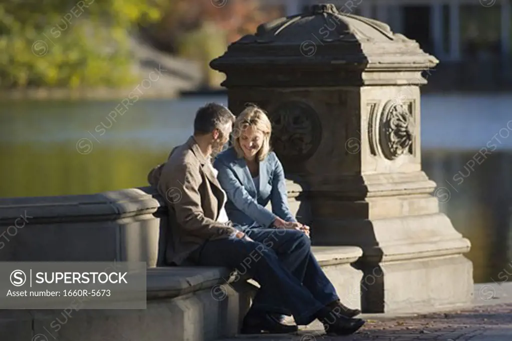 Couple sitting together in a park