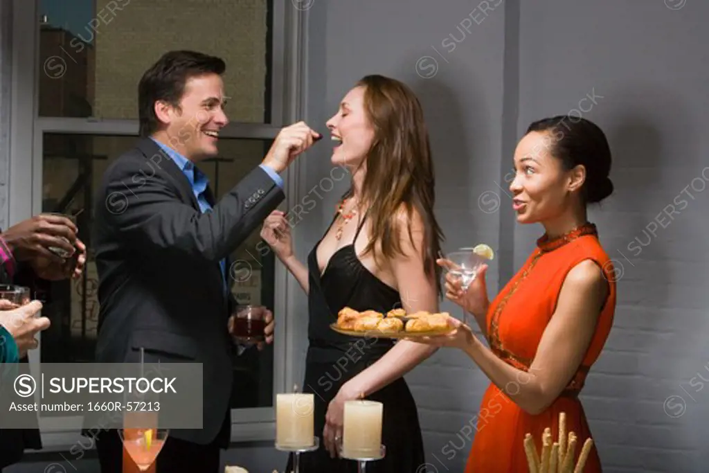Partygoers eating