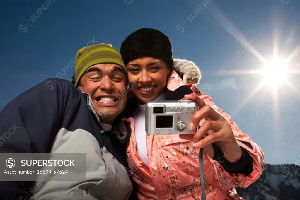Couple using a camera outside