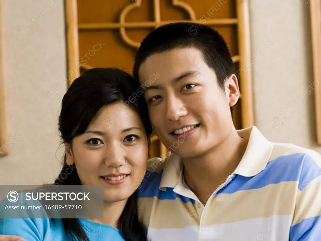 Closeup of couple embracing and smiling