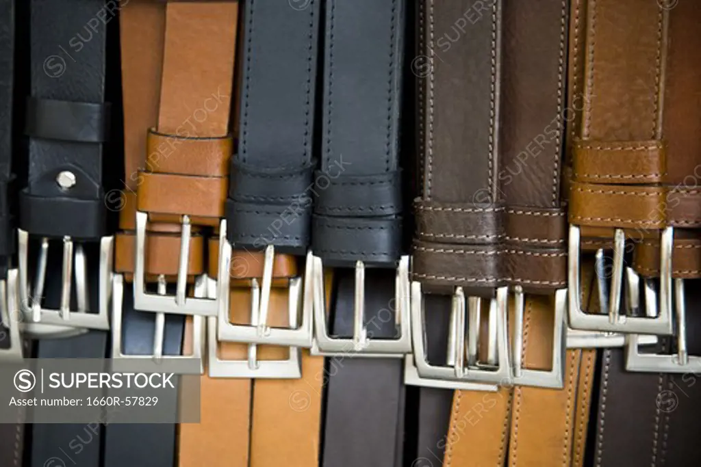 Closeup of belt buckles and leather belts