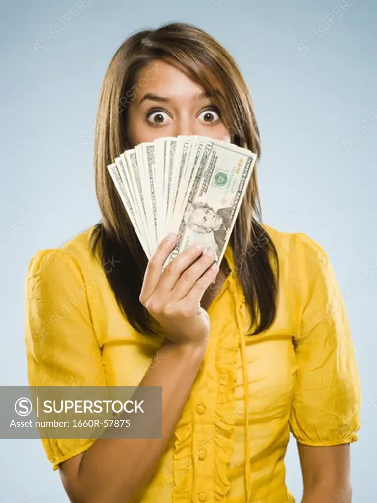 Woman with handful of money