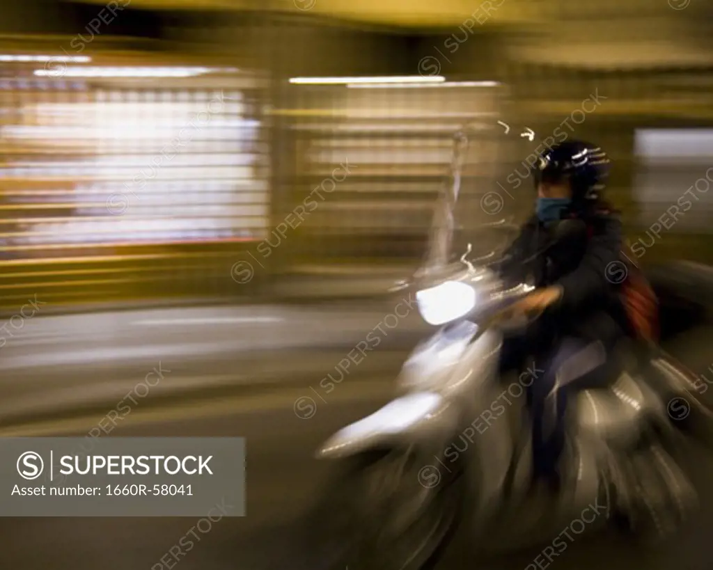 Man on motorcycle with motion blur