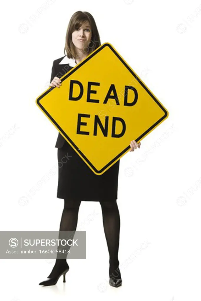 person holding a dead end sign