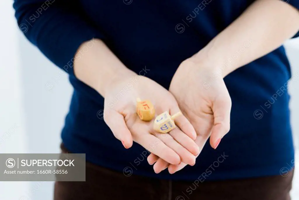 woman holding tow dradles