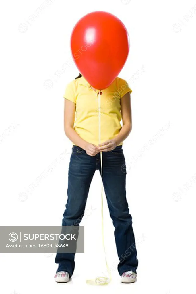 young woman holding a red balloon