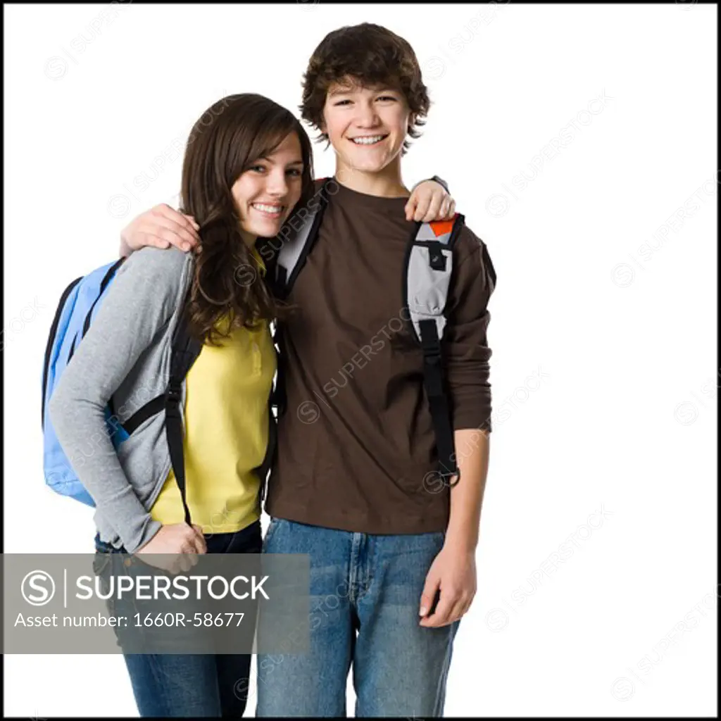 Students with book bags posing