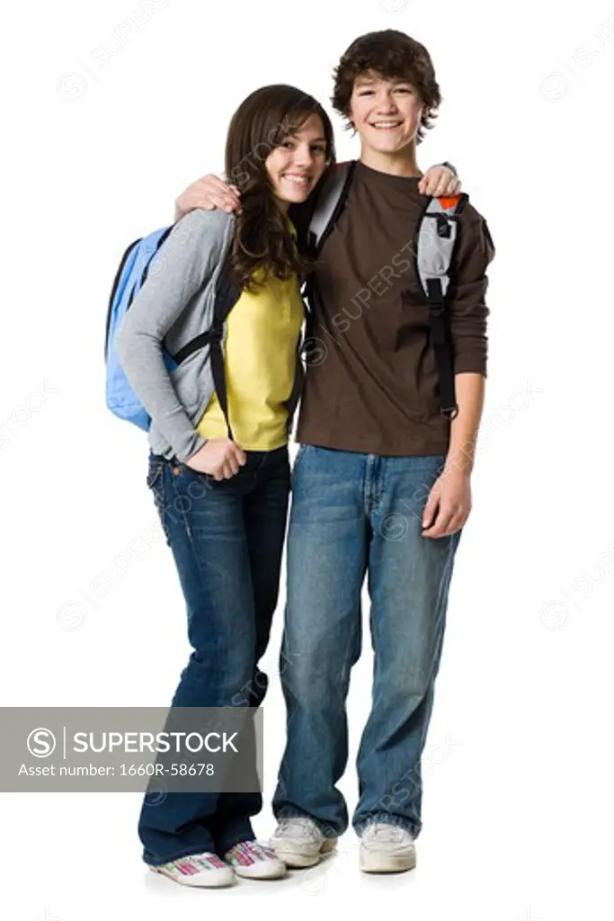 Students with book bags posing