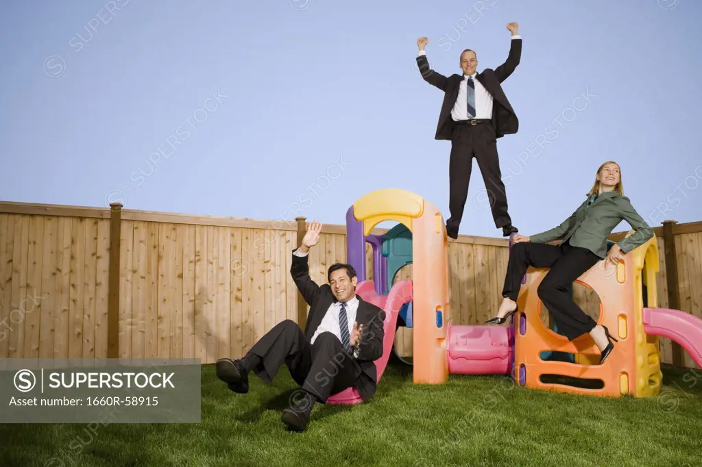 Business people on play structure