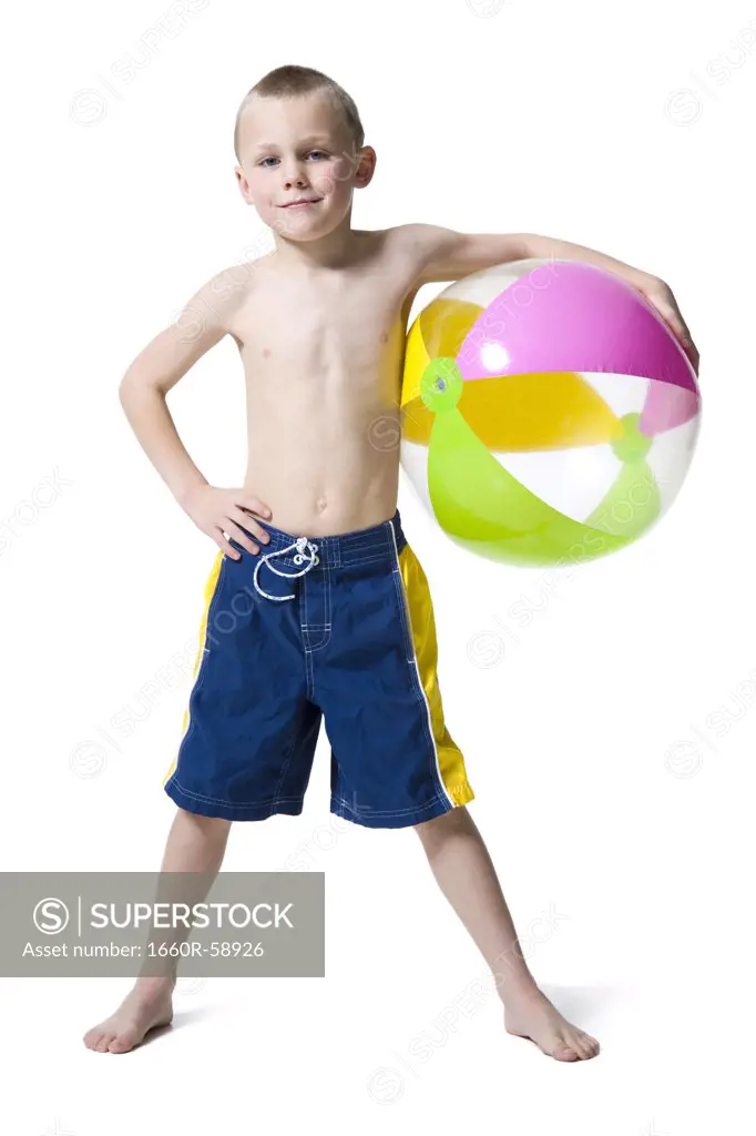 Boy holding beach ball