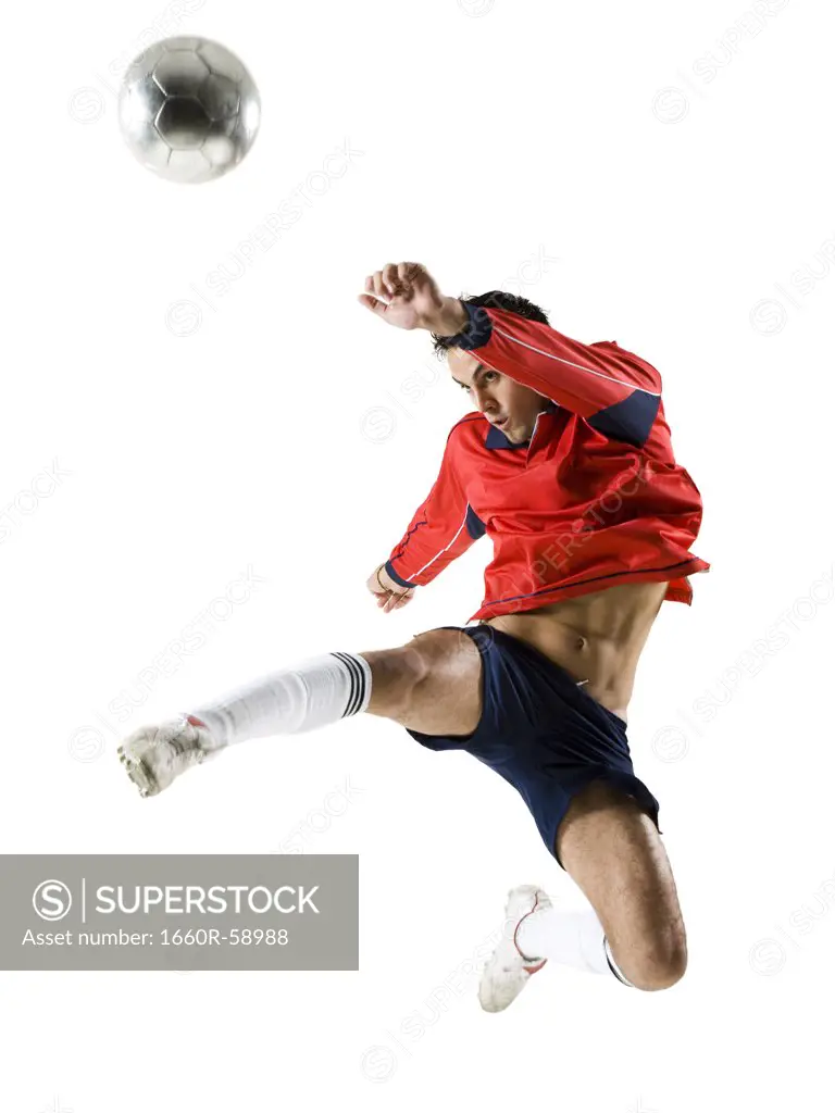 Man jumping for soccer ball