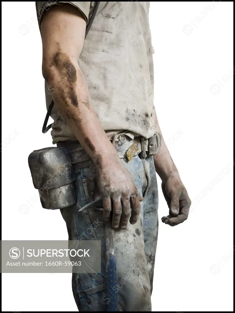 Mine worker in overalls from the neck down