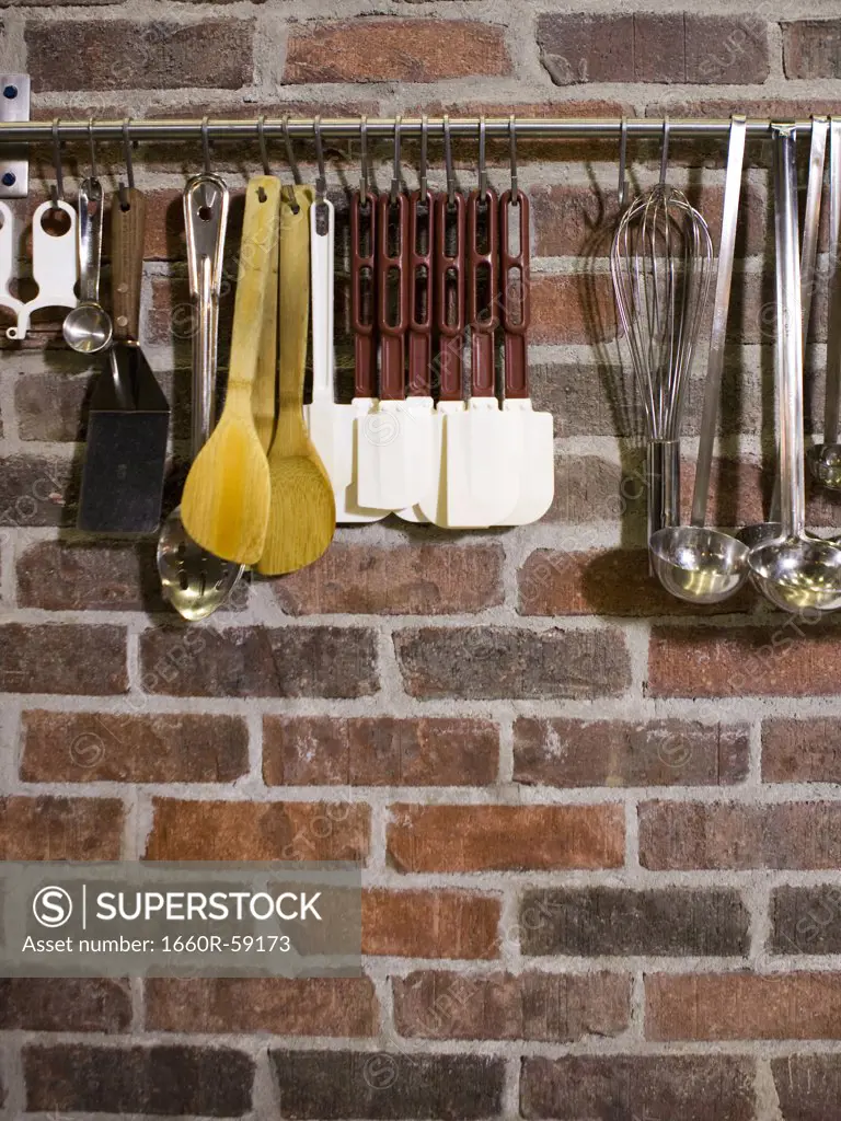 USA, Utah, Orem, close-up of cooking utensils hanging on rail