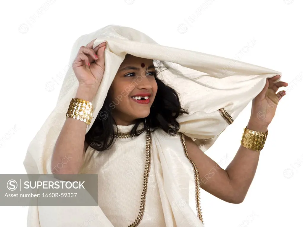 Girl (8-9) wearing traditional sari, portrait, studio-shot