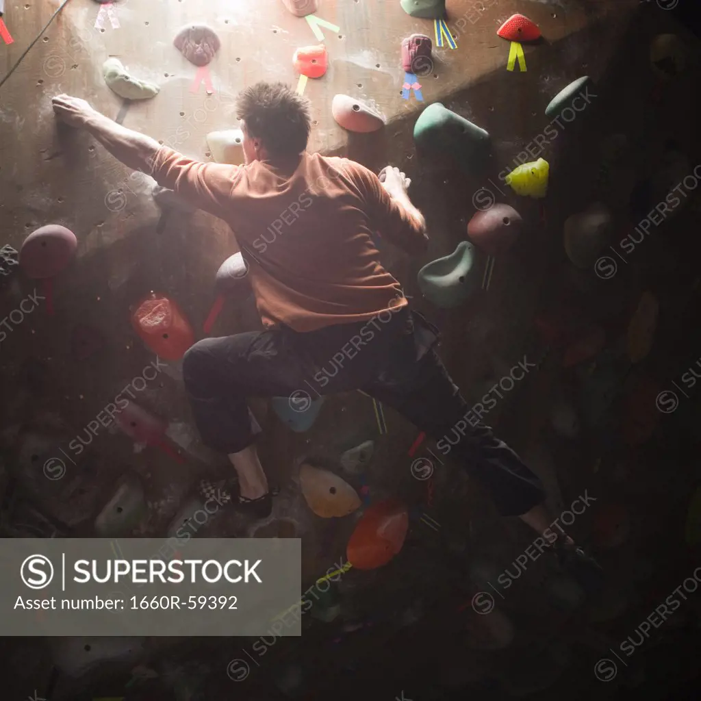 USA, Utah, Sandy, man on indoor climbing wall