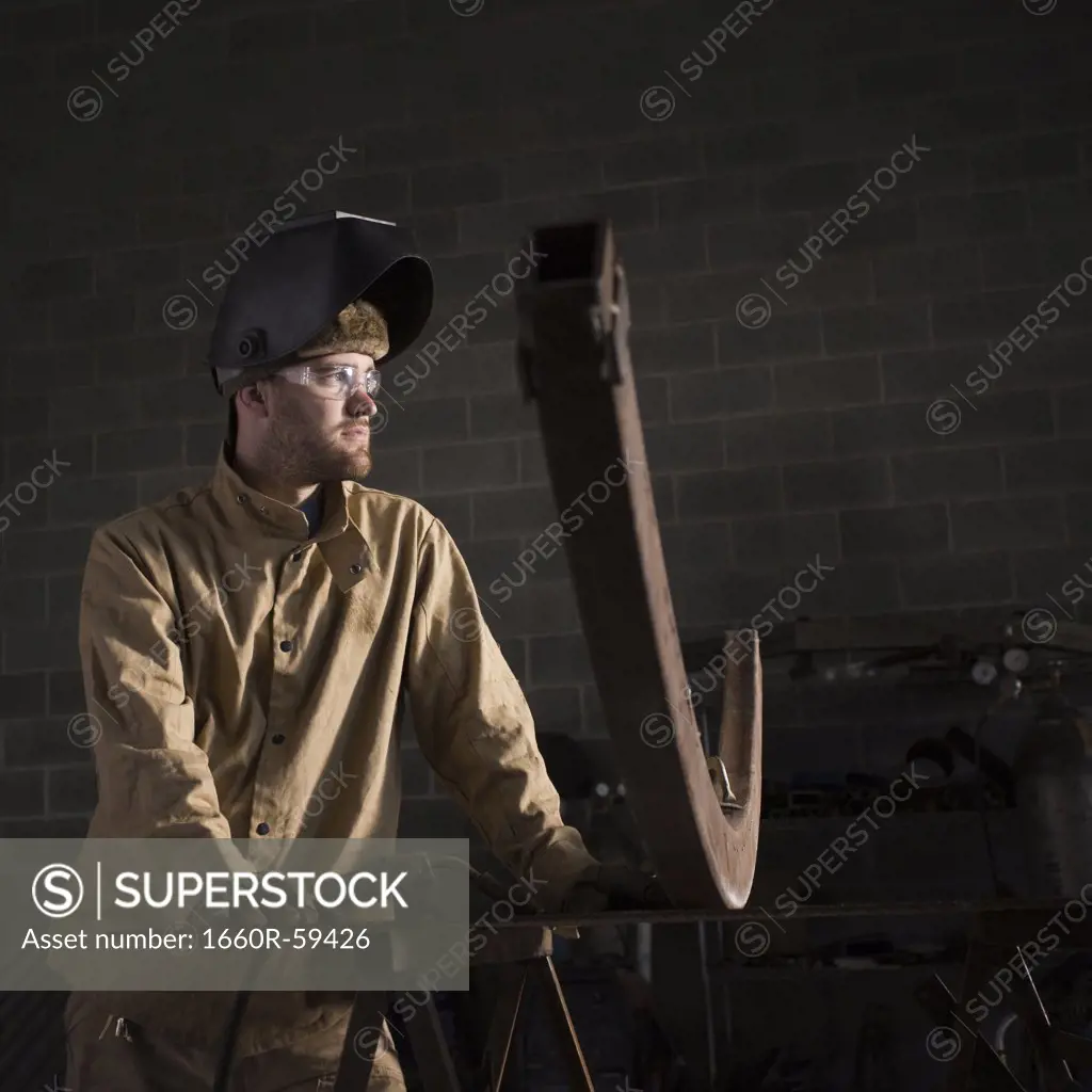 USA, Utah, Orem, male welder in workshop