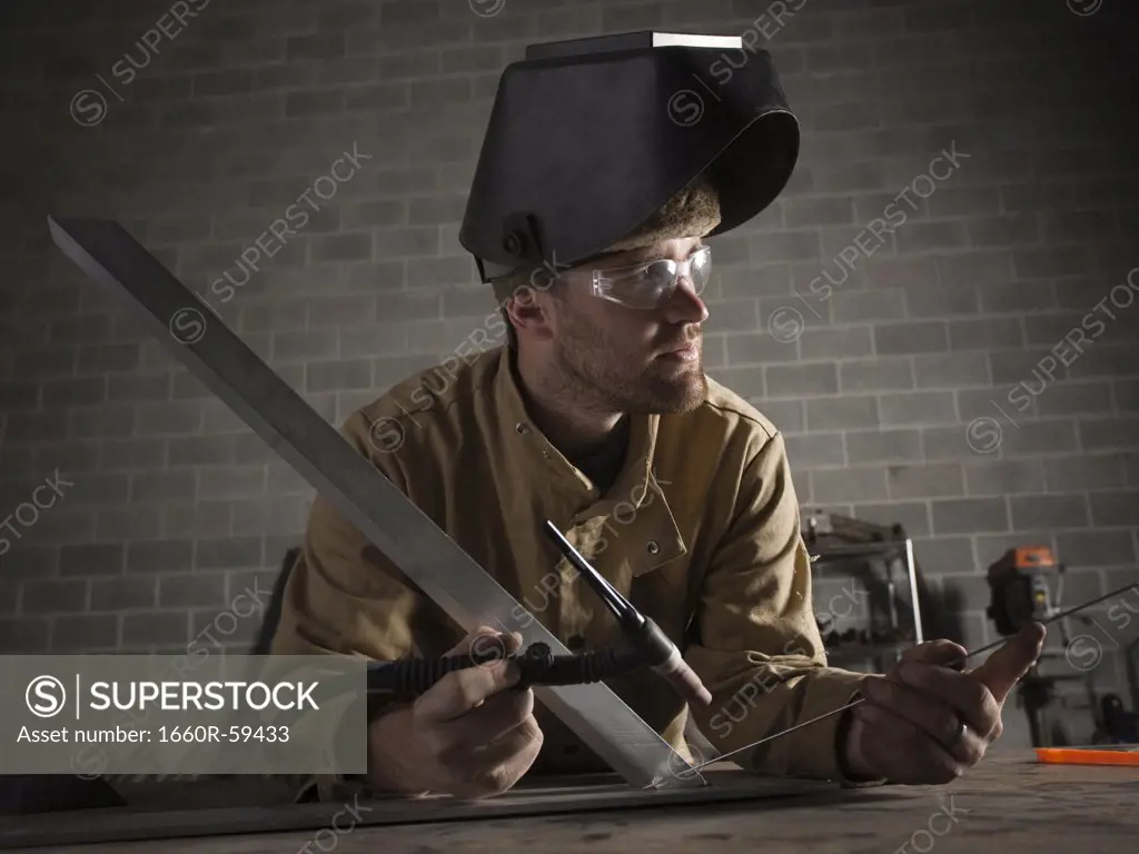 USA, Utah, Orem, male welder in workshop