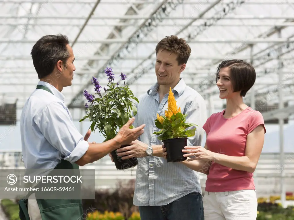 USA, Utah, Salem, couple buying flowers from gardener