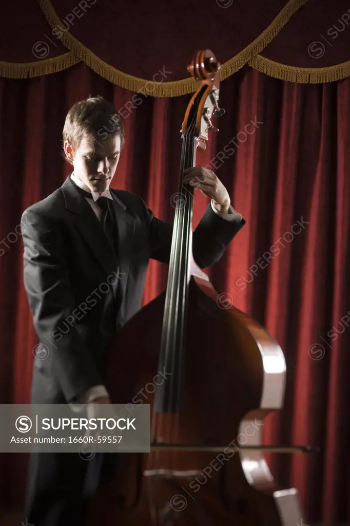 Young man playing double bass