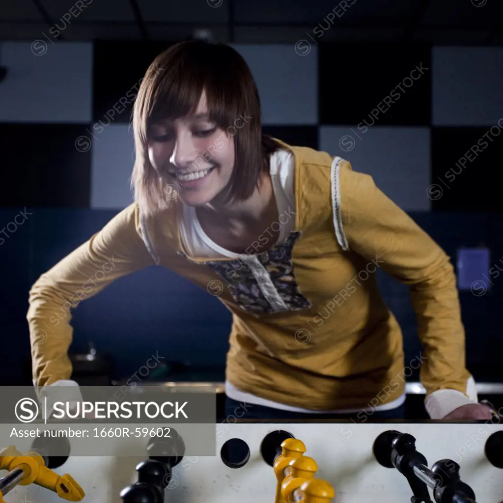 USA, Utah, American Fork, young woman playing table football