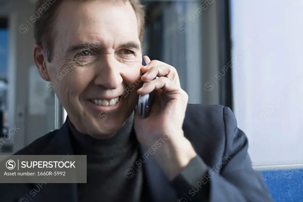 Close-up of a senior man talking on a mobile phone