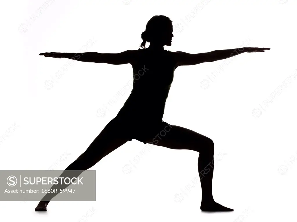 Silhouette of young woman exercising, digital composite