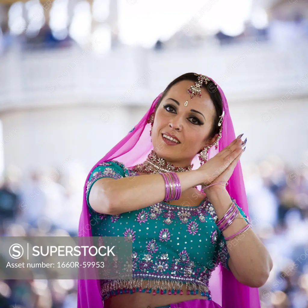 USA, Utah, Spanish Fork, portrait of mid adult dancer in traditional clothing performing on stage
