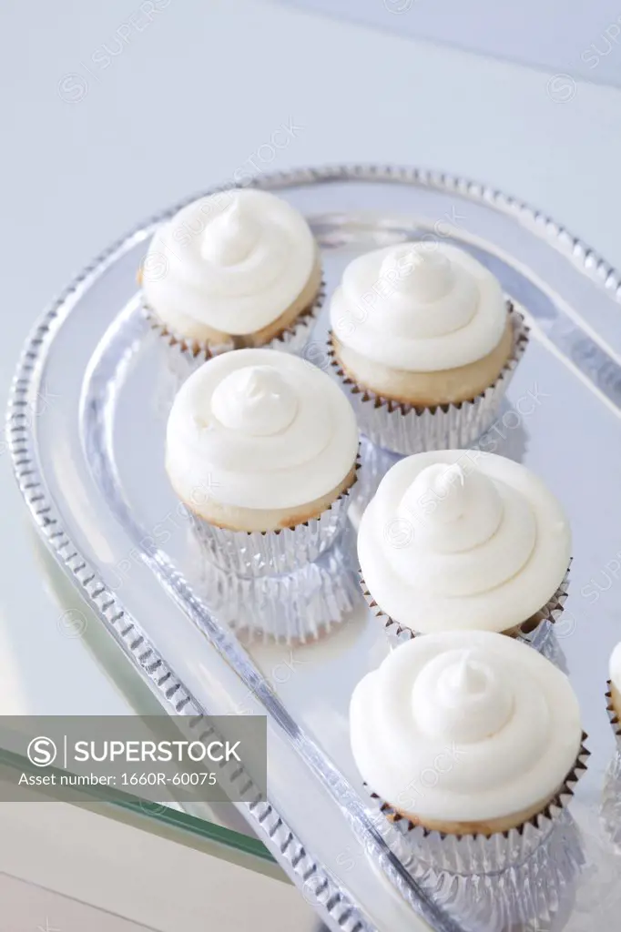 USA, California, San Francisco, cupcakes with frosting on silver plate