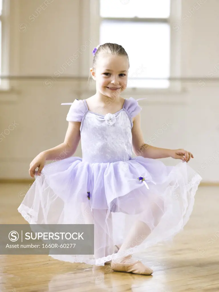 Springville, Utah, USA, Little ballet dancer (4-5) kneeling, portrait