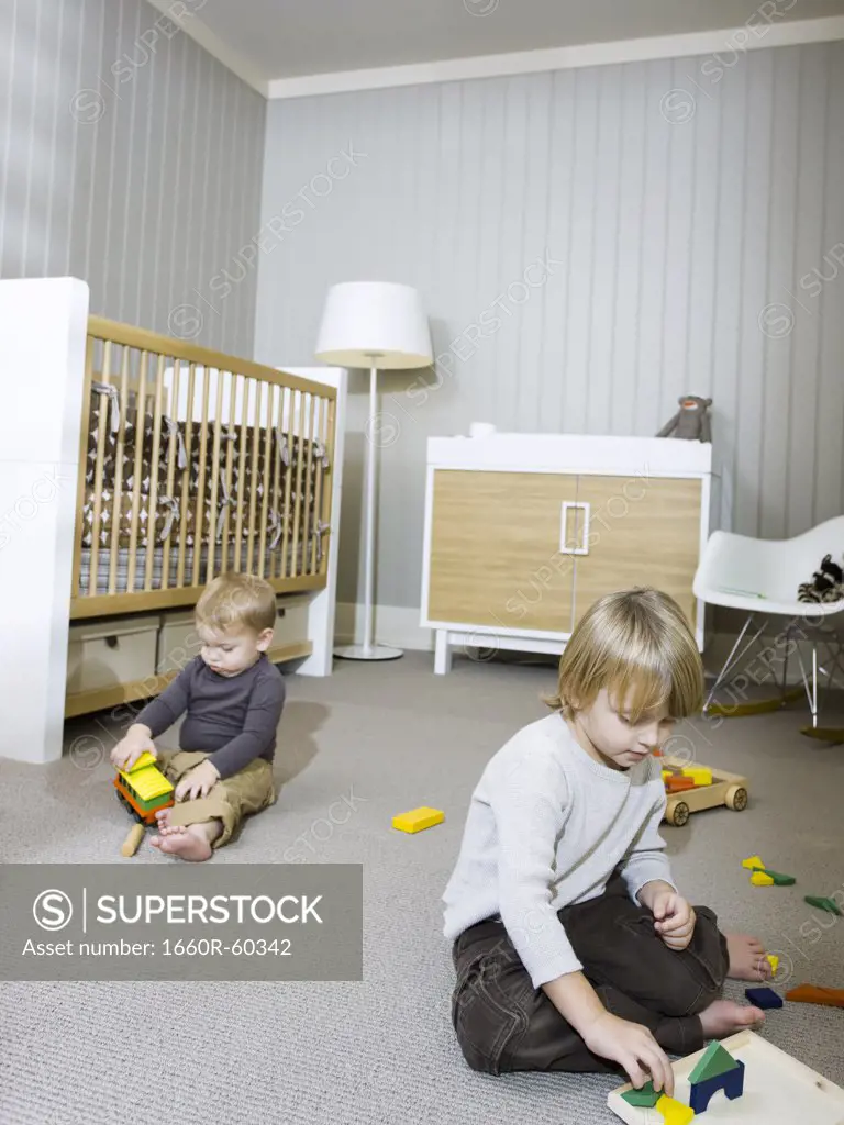 USA, Utah, Provo, Two boys (18-23 months,2-3) playing in home